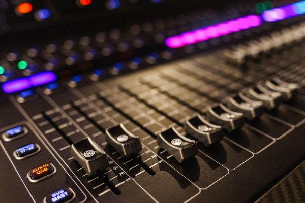 Detailed view of an advanced audio mixing console, perfect for studios.
